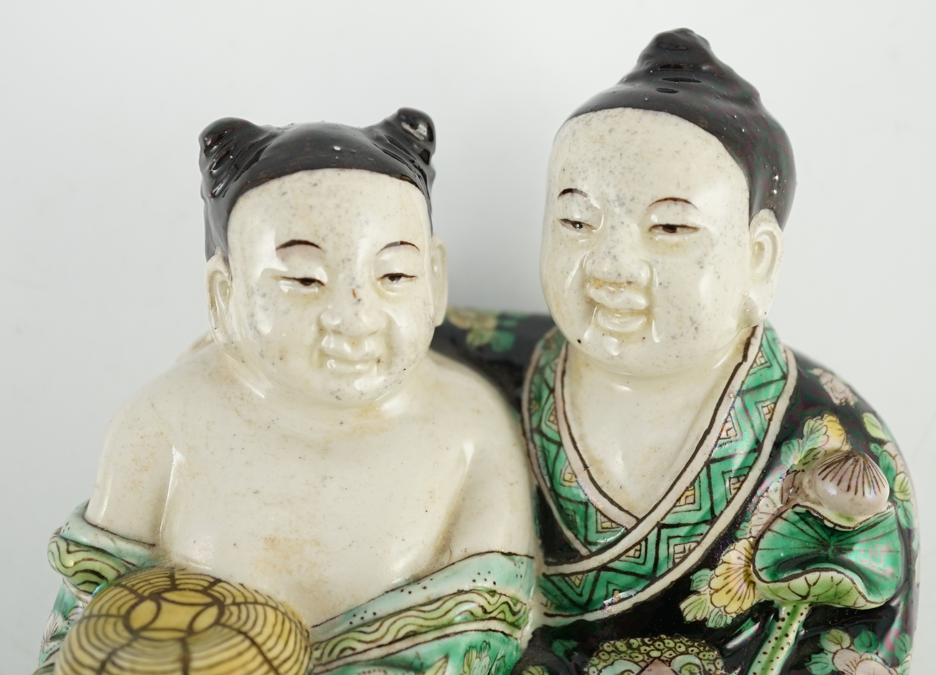 A Chinese famille verte enamelled biscuit group of the Hehe Erxian, possibly 19th century